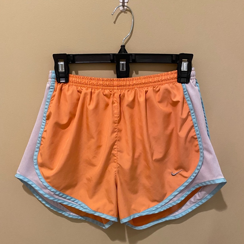 Nike shorts size M. Peachy/orange in color with baby blue detail. No flaws!